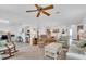 Open living room with hardwood floors and access to the kitchen and dining area at 507 Foxwood Blvd # 4, Englewood, FL 34223