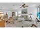 Spacious living room with comfortable seating, a coffee table, and a large TV at 507 Foxwood Blvd # 4, Englewood, FL 34223