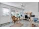Home office with a comfortable chair, desk, and plenty of natural light at 507 Foxwood Blvd # 4, Englewood, FL 34223