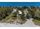 Aerial of beachfront community; shows beach, pool, and building at 5125 Gulf Of Mexico Dr # 7, Longboat Key, FL 34228
