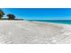 Beautiful white sand beach with clear water and relaxing ocean views at 5125 Gulf Of Mexico Dr # 7, Longboat Key, FL 34228