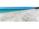 Expansive white sand beach with clear turquoise water at 5125 Gulf Of Mexico Dr # 7, Longboat Key, FL 34228