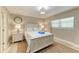 Guest bedroom with a full-size bed and nightstands at 5125 Gulf Of Mexico Dr # 7, Longboat Key, FL 34228
