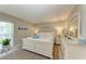 Bright bedroom with white wooden bed frame and en-suite dresser at 5125 Gulf Of Mexico Dr # 7, Longboat Key, FL 34228