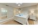 Bedroom with full bed, dresser, and access to bathroom at 5125 Gulf Of Mexico Dr # 7, Longboat Key, FL 34228