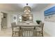 Light-filled dining area with a grey table and four chairs at 5125 Gulf Of Mexico Dr # 7, Longboat Key, FL 34228