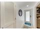 Bright entryway with white walls and beach-themed decor at 5125 Gulf Of Mexico Dr # 7, Longboat Key, FL 34228