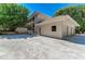 Building exterior, featuring a two-car garage and landscaping at 5125 Gulf Of Mexico Dr # 7, Longboat Key, FL 34228