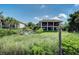 Back exterior showcasing a two-story home with private pool at 5125 Gulf Of Mexico Dr # 7, Longboat Key, FL 34228