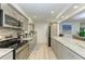 Modern kitchen with stainless steel appliances and granite countertops at 5125 Gulf Of Mexico Dr # 7, Longboat Key, FL 34228