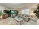 Living room with coastal decor, featuring a comfy sofa and chairs at 5125 Gulf Of Mexico Dr # 7, Longboat Key, FL 34228