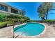 Relaxing kidney-shaped pool with patio furniture and ocean view at 5125 Gulf Of Mexico Dr # 7, Longboat Key, FL 34228