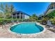 Inviting kidney-shaped pool with lounge chairs at 5125 Gulf Of Mexico Dr # 7, Longboat Key, FL 34228