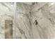 Shower with marble tile and glass enclosure at 5125 Gulf Of Mexico Dr # 7, Longboat Key, FL 34228
