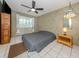 Spacious bedroom with a ceiling fan and large window offering natural light at 601 E Seminole Dr, Venice, FL 34293