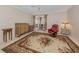 Comfortable living room with a floral rug and access to the sunroom at 601 E Seminole Dr, Venice, FL 34293