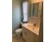 Bathroom with toilet, sink, and medicine cabinet at 607 Cervina Dr, Venice, FL 34285