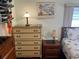 Bedroom with dresser and nightstand at 607 Cervina Dr, Venice, FL 34285