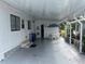 Covered patio with table and chairs, offering shaded outdoor space at 607 Cervina Dr, Venice, FL 34285