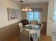 Well-lit dining room with a four-chair table at 607 Cervina Dr, Venice, FL 34285