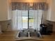 Kitchen sink with double basin, wood countertops, and lace curtains at 607 Cervina Dr, Venice, FL 34285