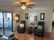 Living room with two recliners, a floor lamp, and access to a sunroom at 607 Cervina Dr, Venice, FL 34285