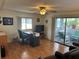 Living room with laminate flooring, office area, and access to a sunroom at 607 Cervina Dr, Venice, FL 34285