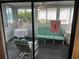 Peaceful sunroom, filled with natural light and comfy seating at 607 Cervina Dr, Venice, FL 34285