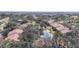 Complex overview showcasing buildings and pond at 654 Bird Bay E Dr # 206, Venice, FL 34285