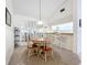 Bright dining area featuring a modern light fixture and a cozy space for gatherings at 654 Bird Bay E Dr # 206, Venice, FL 34285