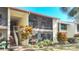 Exterior view of condo showing building, landscaping, and a stairway at 654 Bird Bay E Dr # 206, Venice, FL 34285