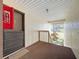 Condo entry with fire extinguisher and view to grassy area at 654 Bird Bay E Dr # 206, Venice, FL 34285