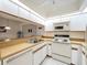 Well-equipped kitchen with ample cabinetry and counter space at 654 Bird Bay E Dr # 206, Venice, FL 34285