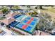 The aerial features community pickleball courts near shuffleboard, creating a vibrant recreational space at 654 Bird Bay E Dr # 206, Venice, FL 34285