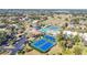 Aerial shot featuring community tennis courts, a pool, and ample parking for residents and guests at 654 Bird Bay E Dr # 206, Venice, FL 34285