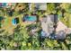 Aerial view of a house with a pool and detached shed at 690 Percheron, Nokomis, FL 34275