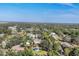 Aerial view of houses nestled amongst the trees at 690 Percheron, Nokomis, FL 34275