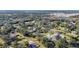 Aerial view of a residential neighborhood showcasing various houses and lush greenery at 690 Percheron, Nokomis, FL 34275