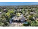 Aerial view of a house with a large yard and detached garage at 690 Percheron, Nokomis, FL 34275