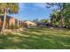 Spacious backyard with a large screened enclosure and a grassy lawn at 690 Percheron, Nokomis, FL 34275