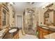 Large bathroom with double vanities, walk in shower, and decorative mirrors at 690 Percheron, Nokomis, FL 34275