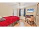 Spacious bedroom with a double bed, desk and ceiling fan at 690 Percheron, Nokomis, FL 34275