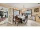 Dining room with chandelier and access to sunroom at 690 Percheron, Nokomis, FL 34275