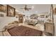 Main bedroom with king-size bed, ornate furniture, and ceiling fan at 690 Percheron, Nokomis, FL 34275