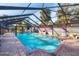 Inviting screened-in pool with brick patio and painted walls at 690 Percheron, Nokomis, FL 34275