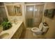 Clean bathroom with a shower and updated fixtures at 701 S Green Cir, Venice, FL 34285