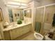 Bathroom boasts double sinks, a shower, and updated vanity at 701 S Green Cir, Venice, FL 34285