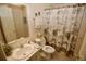 Clean bathroom with a shower/tub combo and updated fixtures at 701 S Green Cir, Venice, FL 34285
