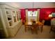 Bright dining area with a built-in hutch and wood dining table at 701 S Green Cir, Venice, FL 34285