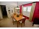 Dining room with built-in hutch and wood table with four chairs at 701 S Green Cir, Venice, FL 34285